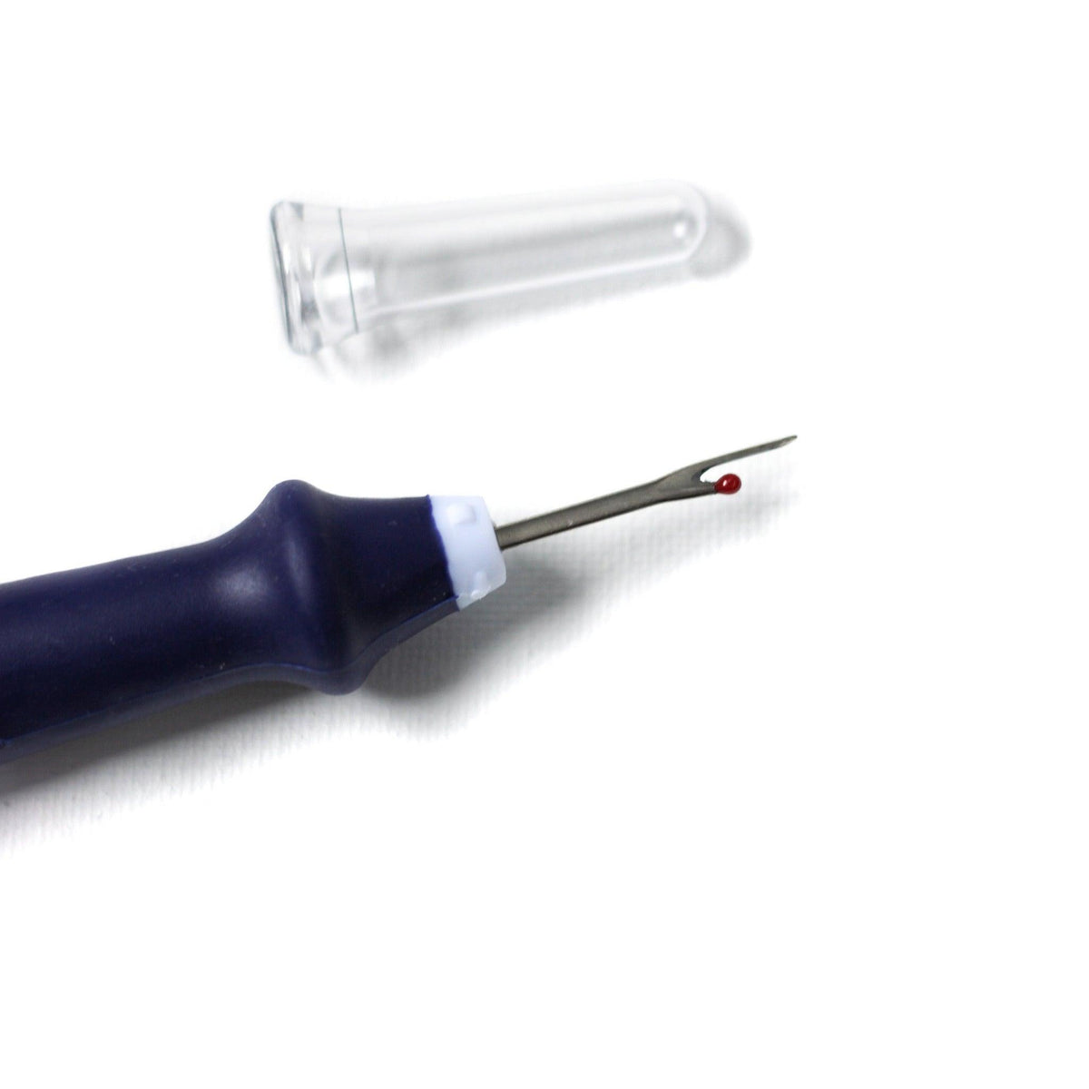 Close-up of the navy blue seam ripper tip